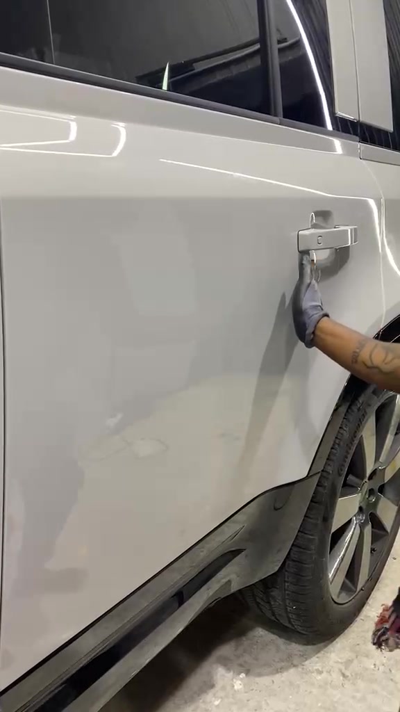 Ceramic coating application in progress on white vehicle
