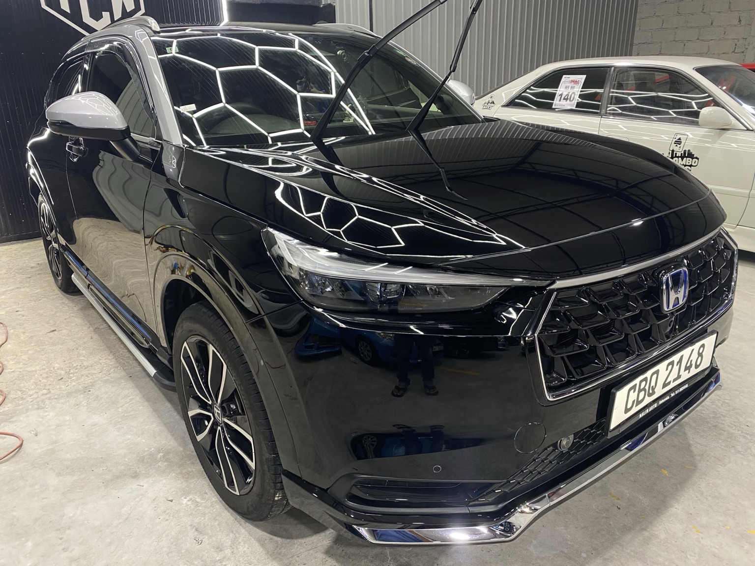 Black Honda SUV after ceramic coating at ModMasters